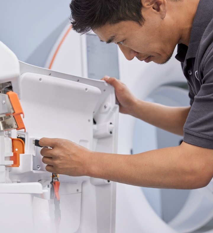 Service professional inspecting MEDRAD<sup>®</sup> Centargo