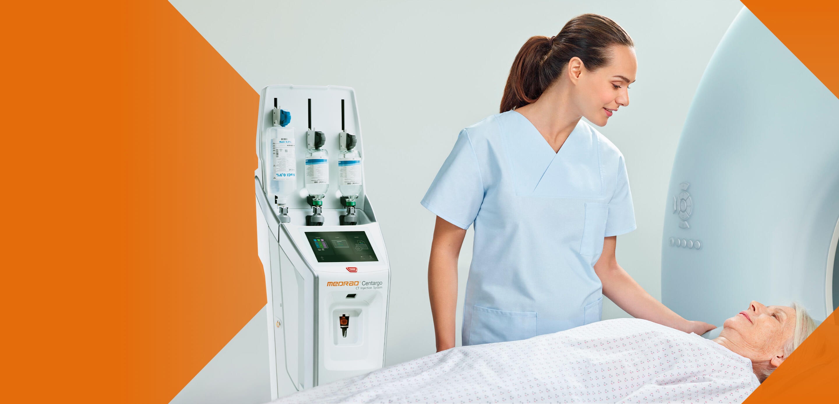 Healthcare worker prepares patient for CT scan